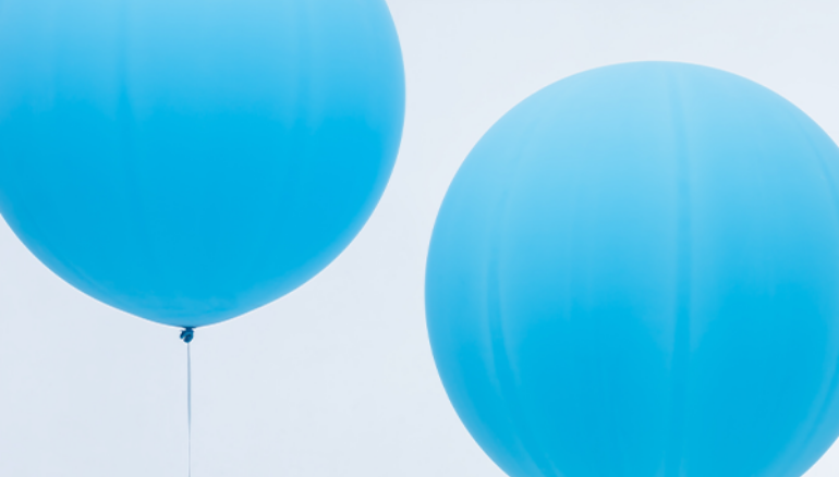 Photo of two inflated blue balloons