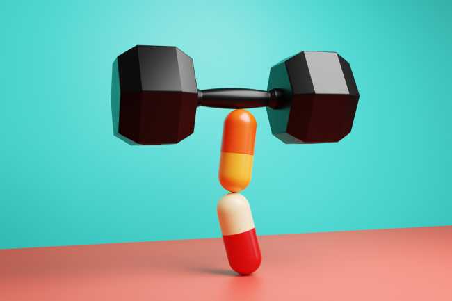 two stacked pills lifting a dumbell